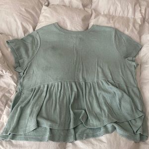 teal woman’s shirt